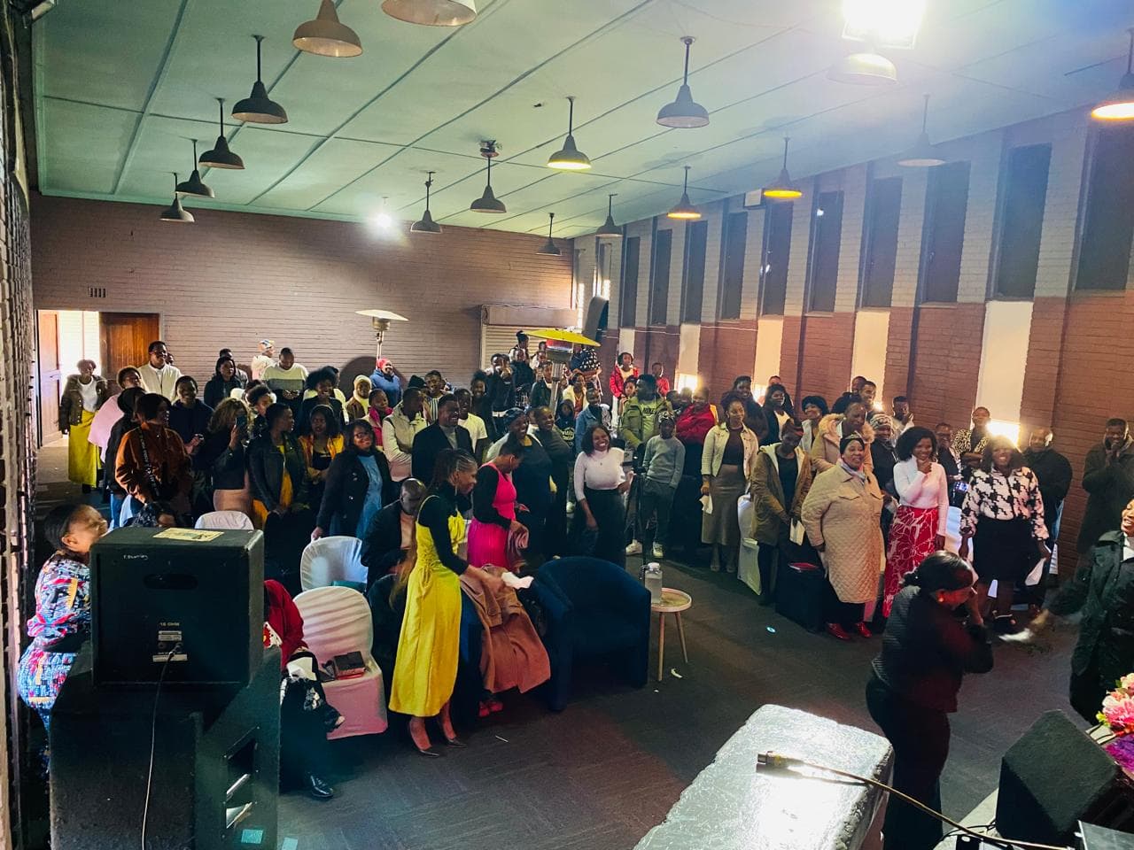 Front-facing congregation moment during service at Renewed Life.