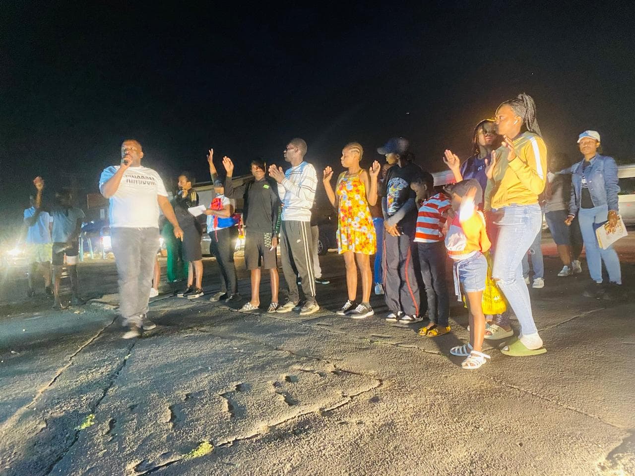 Open-air outreach gathering linked to Renewed Life ministry.